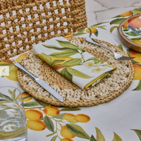 Thumbnail for Palma braided placemat styled with a folded lemon print napkin and cutlery on a citrus tablecloth