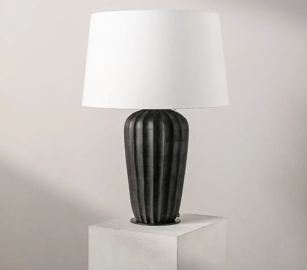 Kai table lamp with a ribbed matte black wood base and natural cotton shade