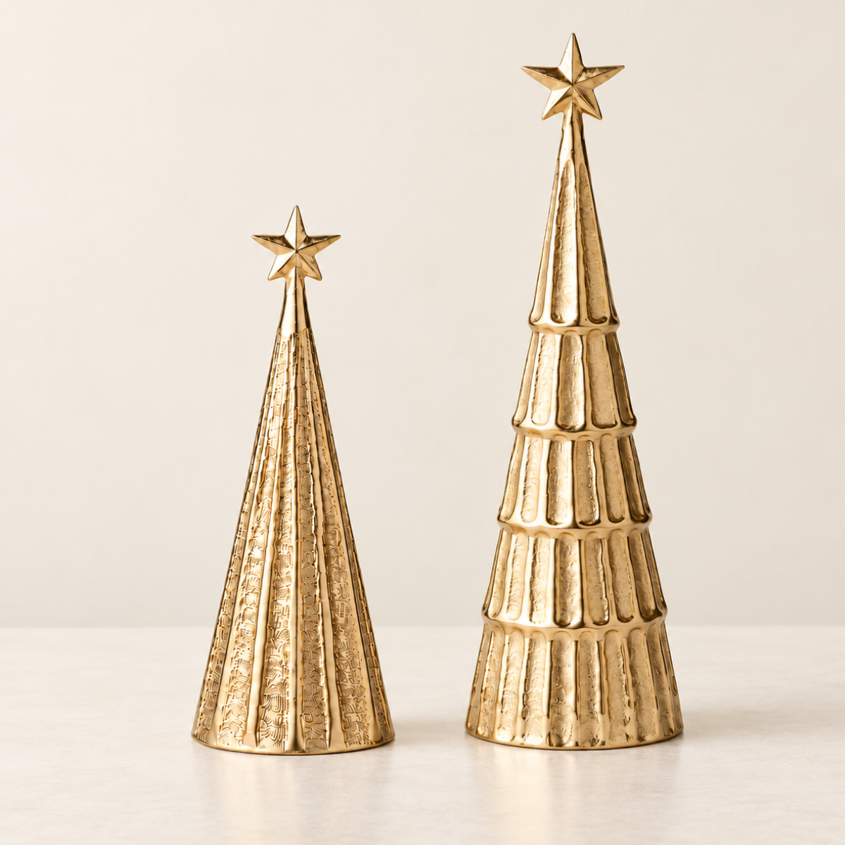 Gold Sparkle Christmas tree sculptures, large 42cm and small 27cm, side by side