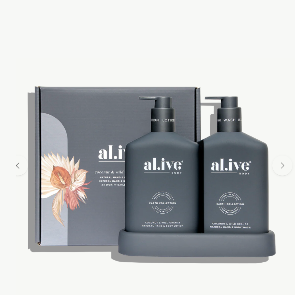 al.ive Coconut and Wild Orange hand wash and lotion duo in a ceramic tray