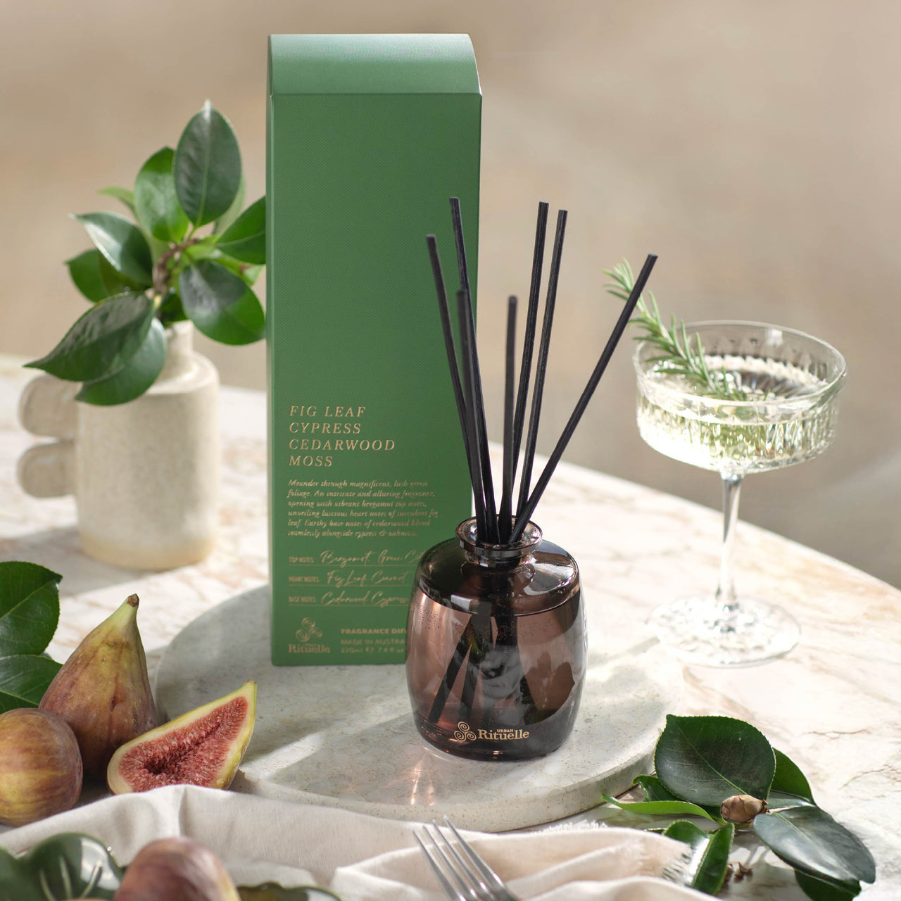 Fig Leaf reed diffuser styled on a side table