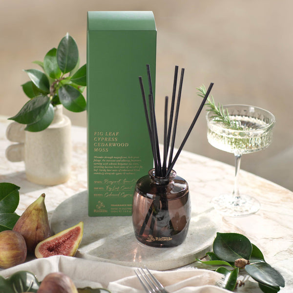 Fig Leaf reed diffuser styled on a side table