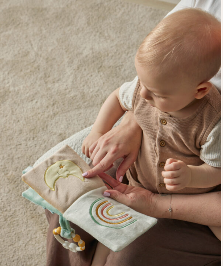 Baby reading the sage green teddy bear activity fabric book
