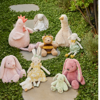 Thumbnail for Stanley plush sheep soft toy, alternate view styled with flowers