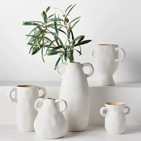 Thumbnail for Cavo ceramic vases in white grouped on a shelf, styled with olive stems