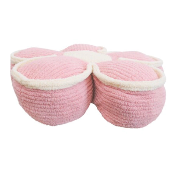 Pink flower cushion shown from a second angle, showing the petal shape and soft polyester finish