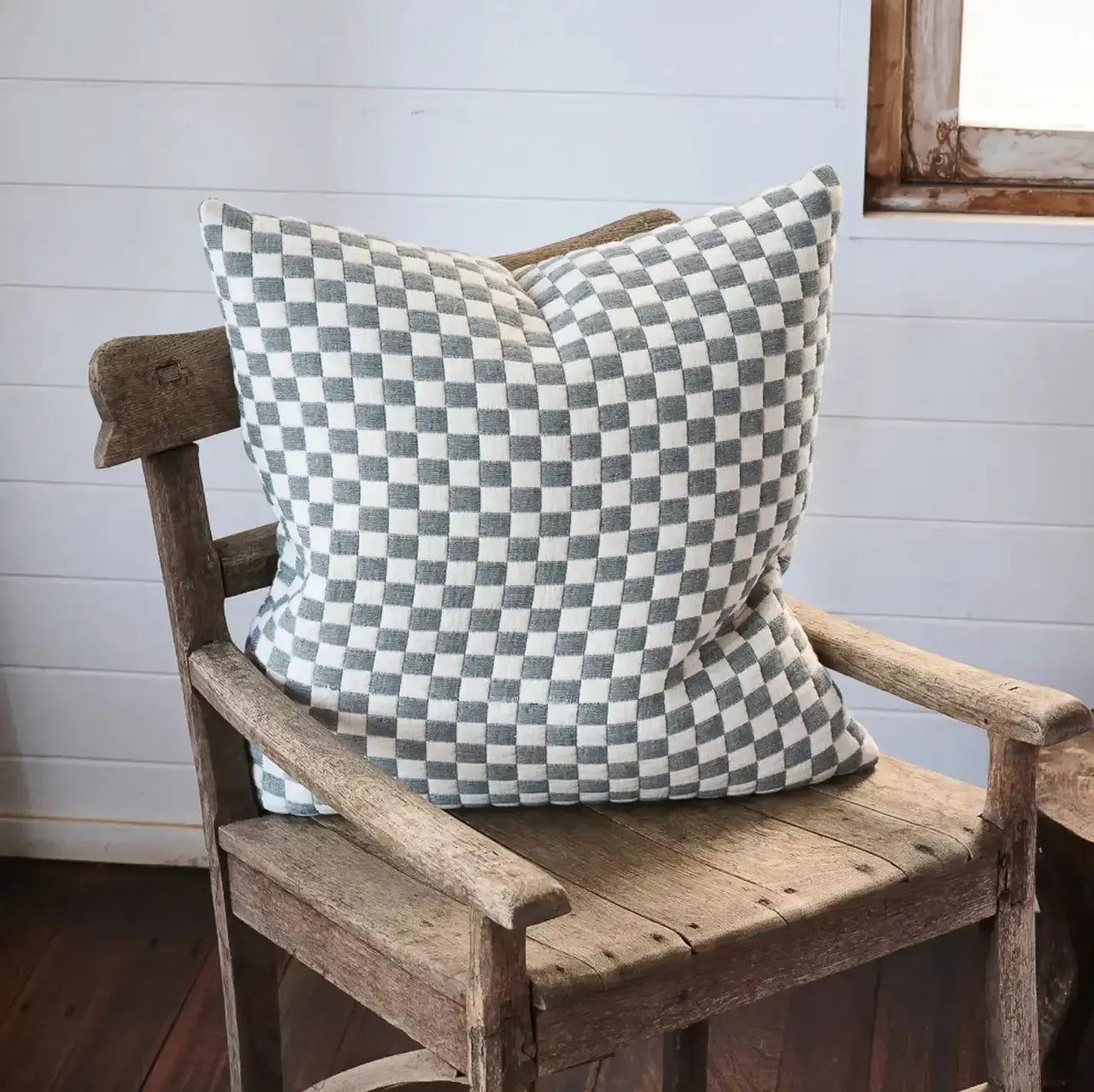 Gambit cushion in off-white and blue cotton jacquard, on a sofa