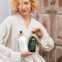 Thumbnail for Lemongrass hand and body wash beside the matching lotion on a basin