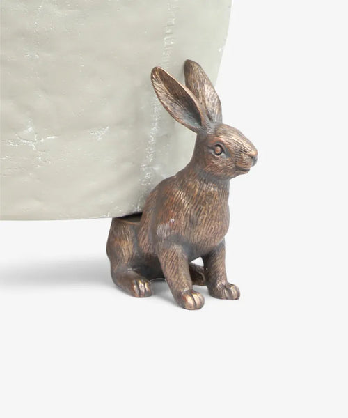 Provincial hare pot stand in brass-finish resin, single hare supporting a pot