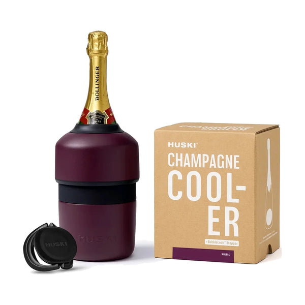 Huski Champagne Cooler in Malbec holding a bottle of champagne, with its BubbleLock stopper and kraft gift box | House of Dudley