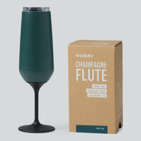 Thumbnail for Huski Champagne Flute in Deep Teal with black TwistLock stem and clear lid, beside its kraft gift box | House of Dudley