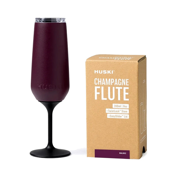 Huski Champagne Flute in Malbec with black TwistLock stem and clear lid, beside its kraft gift box | House of Dudley