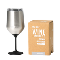 Thumbnail for Silver wine tumbler with black stem next to its packaging box on a white background