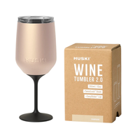 Thumbnail for HUSKI wine tumbler with black stem and beige body next to its packaging on a white background