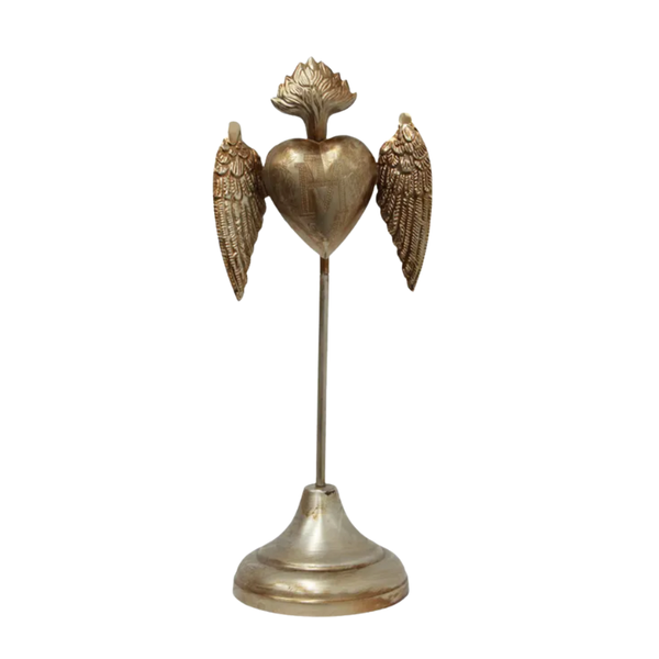 Decorative object with a heart shape, wings, and a pedestal on a white background