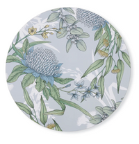 Thumbnail for Round placemat with floral design featuring green leaves and blue flowers on a light blue background