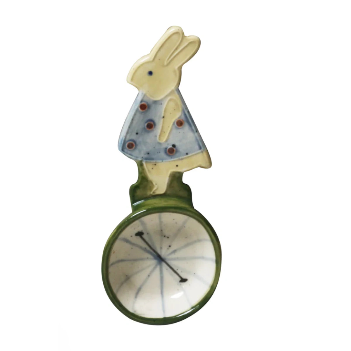 Decorative item with a rabbit character on a unicycle against a white background