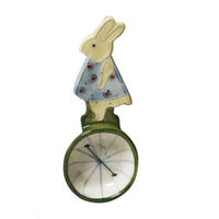 Thumbnail for Decorative item with a rabbit character on a unicycle against a white background