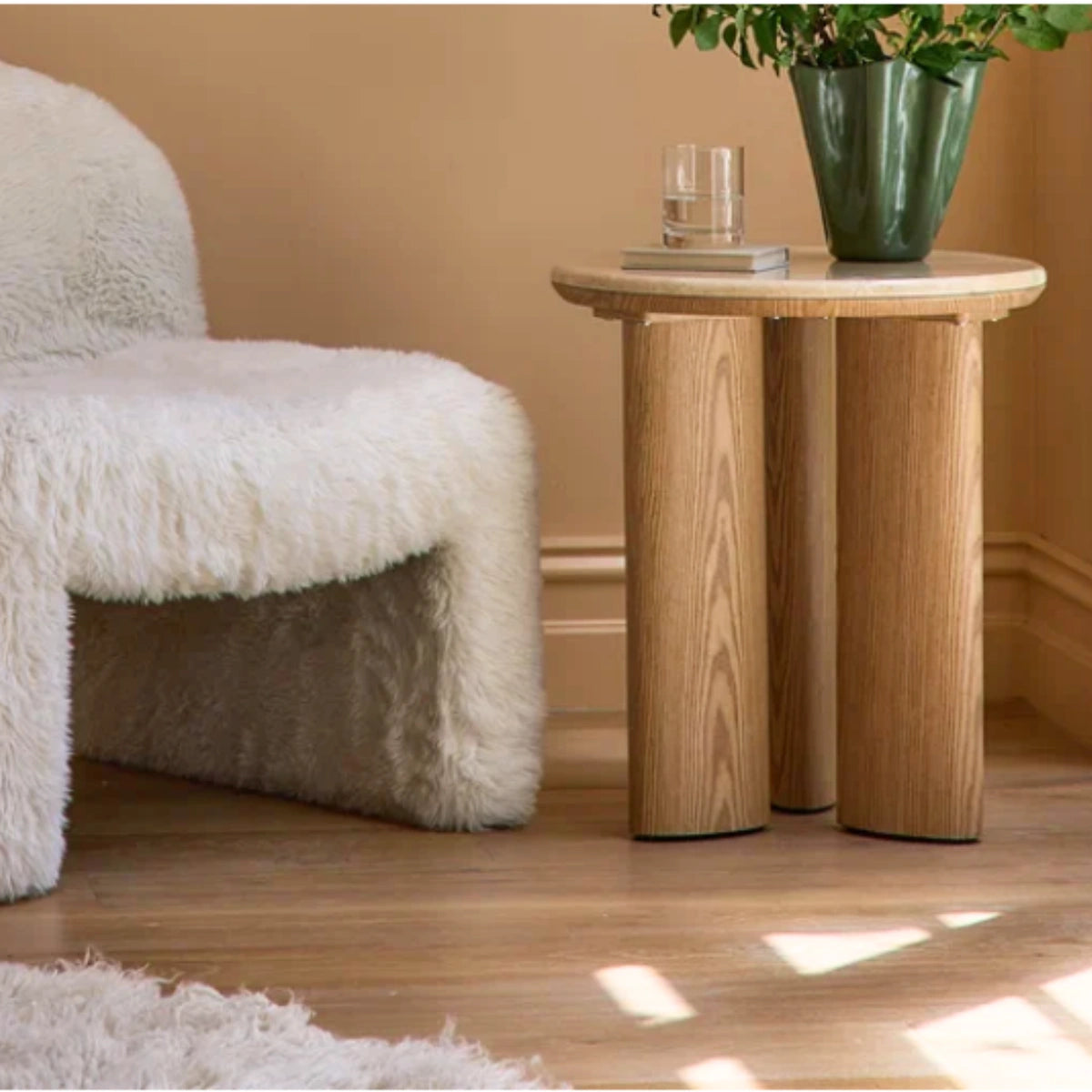 Carlyle brown marble side table shown from a second angle, showing the veined marble top and oak-toned base