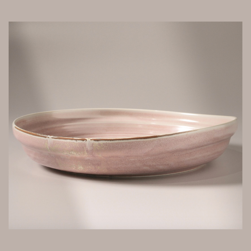 Pink ceramic bowl on a gray background