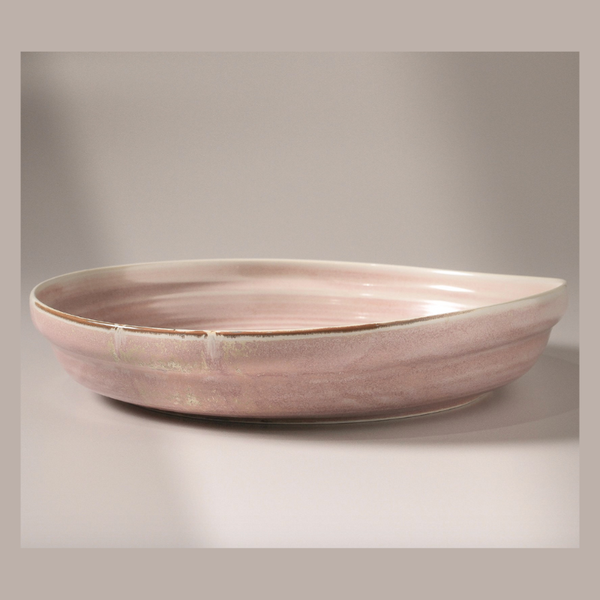 Pink ceramic bowl on a gray background