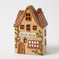 Thumbnail for Book Shop tealight holder, golden stoneware storybook bookshop with climbing greenery