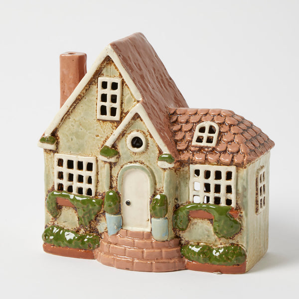 Hearthstone tealight holder, sage green stoneware cottage with arched door and garden