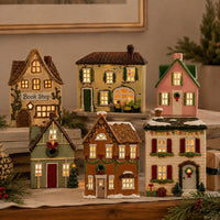 Thumbnail for Mistletoe Lane tealight holder, alternate view with other Christmas village houses
