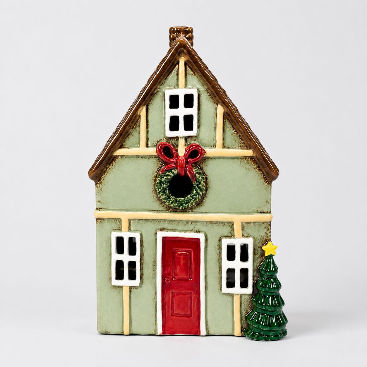 Mistletoe Lane tealight holder, sage green stoneware Christmas house with red door and wreath
