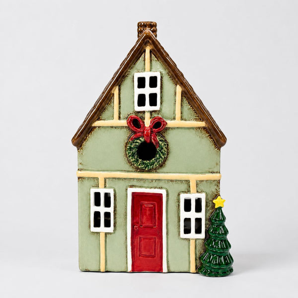 Mistletoe Lane tealight holder, sage green stoneware Christmas house with red door and wreath