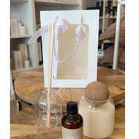 Thumbnail for Aromatherapy diffuser with a bottle and a ball on a wooden table.